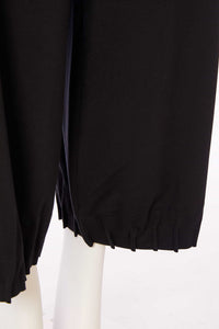 Wide leg trouser with tuck hem detail
