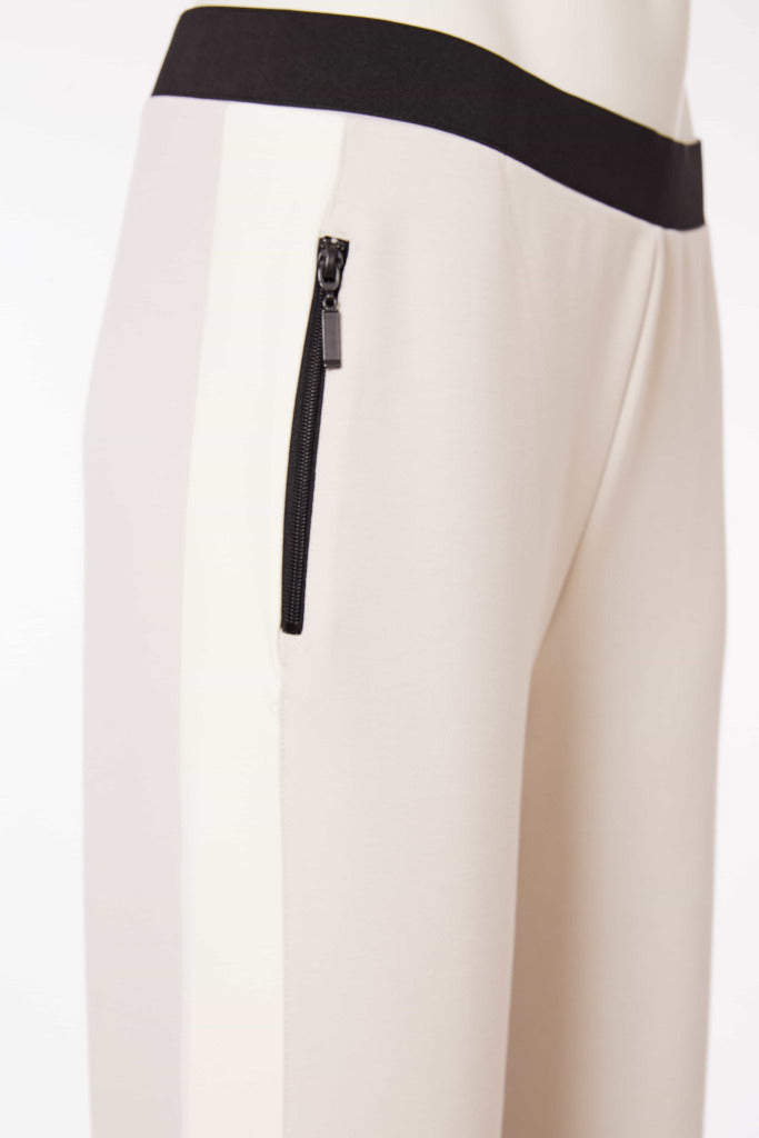 Pull up trouser with contrast panel at side seam and zip pocket