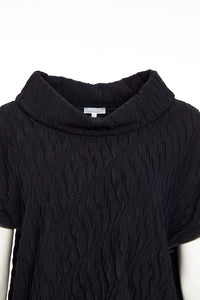 Embossed knit top with collar and zip detail on side seam Description
