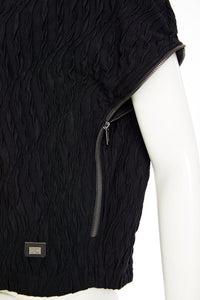 Embossed knit top with collar and zip detail on side seam Description