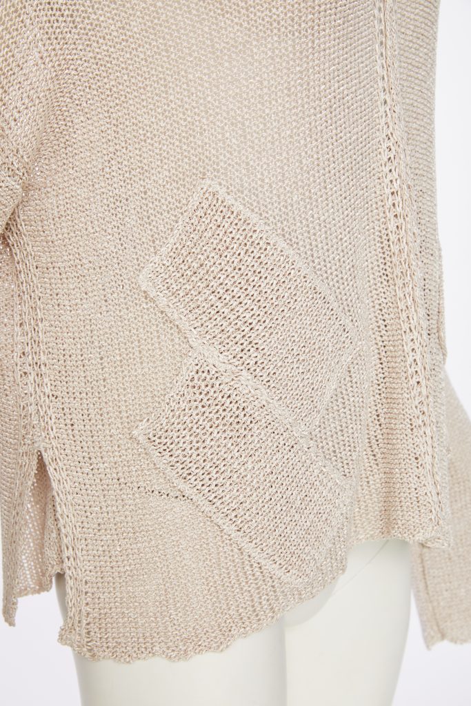 loose weave V neck knit with layed on sections